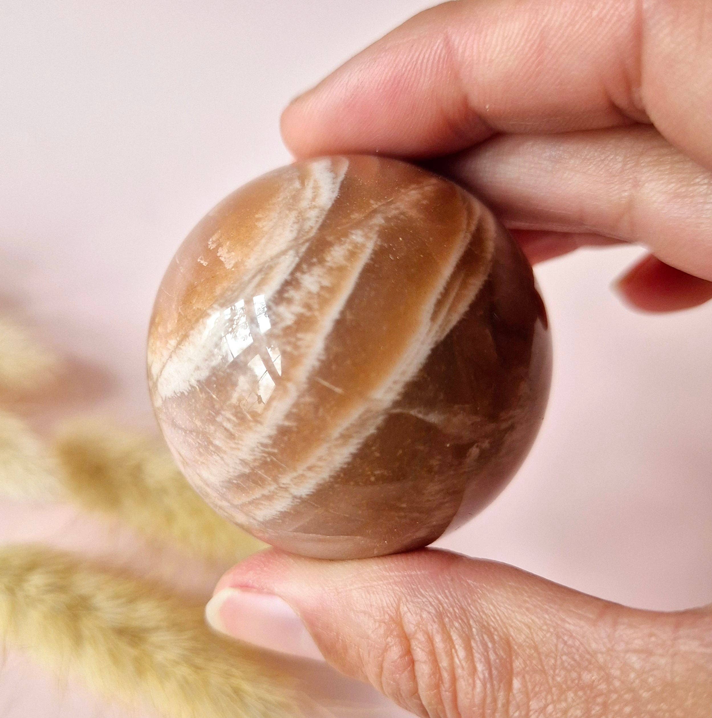 Crystal Gemstone Golden Sunstone Sphere with Blue & Gold Flash | 45–63 mm sphere: 55 mm