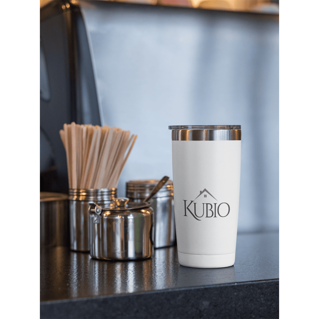 https://kubiostudios.com/cdn/shop/products/20-oz-travel-mug-mockup-placed-by-stainless-steel-kitchen-containers-30390_1024x1024.png?v=1672268766